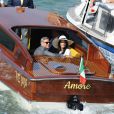 George Clooney et sa femme Amal Alamuddin quittent Venise, le 29 septembre 2014 après leur mariage.