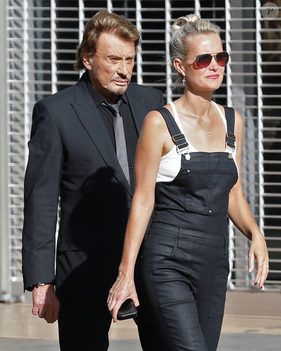 Johnny Hallyday avec sa femme Laeticia sur le tournage de son nouveau clip "Seul" (chanson de son nouvel album "Rester Vivant") à Los Angeles, le 12 octobre 2014.