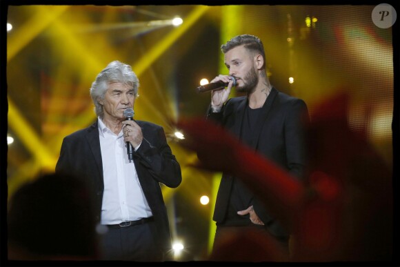 Exclusif - Daniel Guichard et le chanteur M.Pokora (Matt Pokora) interprètent la chanson "Mon Vieux" lors de l'édition 2014 de la "Fête de la chanson française" diffusée sur France 2, enregistrée au Studio TSF à Aubervilliers, le 21 novembre 2014.