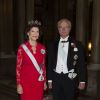 Le roi Carl Gustav et la reine Silvia de Suède arrivant au dîner donné par le couple royal en l'honneur des lauréats des Prix Nobel au palais royal à Stockholm, le 11 décembre 2014.