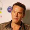 Charity Day BGC 2014 - Benjamin Castaldi - Courtier d'un jour pour encourager les clients à passer ce jour-là le maximum d'ordres dans la salle des marchés d'Aurel BGC Rue Vivienne à Paris. Le 11 septembre 2014.