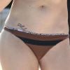 Exclusif - LeAnn Rimes se détend en bikini au bord de la piscine avec son mari Eddie Cibrian et des amis pendant ses vacances à Mexico, le 31 décembre 2014. La rumeur dit que son mari l'aurait à nouveau trompée.o