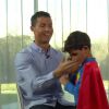 Le fils de Cristiano Ronaldo (Real Madrid) intervient en pleine interview déguisé en Superman le 14 janvier 2015. 