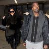 Kim Kardashian et son mari Kanye West arrivent à l'aéroport de Dulles à Washington. Kim Kardashian porte des nu pieds en fourrure! Le 24 janvier 2015  