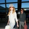 La chanteuse Jennifer Lopez et son petit ami Casper Smart arrivent ensemble mais sont photographiés séparément le 10 février 2015, à l'aéroport LAX de Los Angeles.