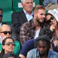 M. Pokora et sa compagne Scarlett Baya assistent aux Internationaux de France de tennis de Roland-Garros à Paris le 2 juin 2014.