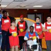 Les handballeurs Thierry Omeyer et Xavier Barachet rendent visite à des enfants malades de la Clinique Edouard Rist à Paris le 24 février 2015 dans le cadre du programme "Sport à l'Hôpital" de l'association Premiers de Cordée. 