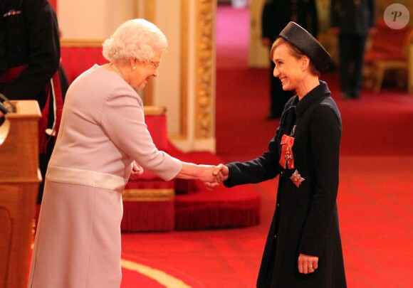 Dame Kristin Scott Thomas is made a Dame Commander of the British Empire by Queen Elizabeth II during an Investiture ceremony at Buckingham Palace in London, UK on March 19, 2015. Photo by Jonathan Brady/PA Wire/ABACAPRESS.COM19/03/2015 - London