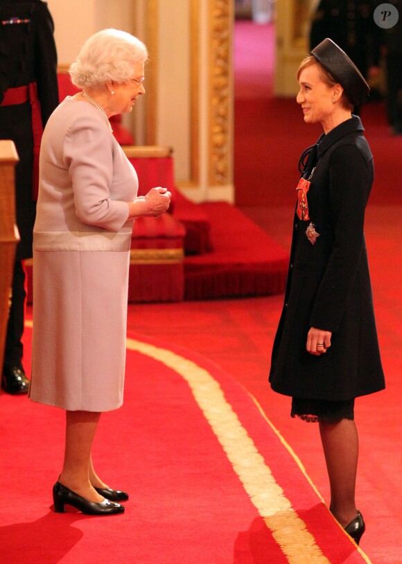 Dame Kristin Scott Thomas is made a Dame Commander of the British Empire by Queen Elizabeth II during an Investiture ceremony at Buckingham Palace in London, UK on March 19, 2015. Photo by Jonathan Brady/PA Wire/ABACAPRESS.COM19/03/2015 - London