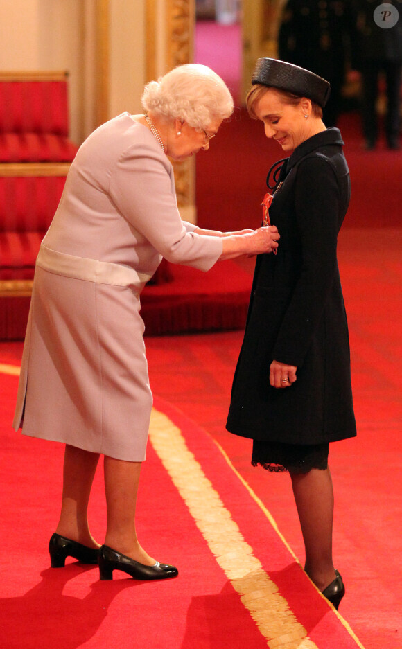 Dame Kristin Scott Thomas is made a Dame Commander of the British Empire by Queen Elizabeth II during an Investiture ceremony at Buckingham Palace in London, UK on March 19, 2015. Photo by Jonathan Brady/PA Wire/ABACAPRESS.COM19/03/2015 - London