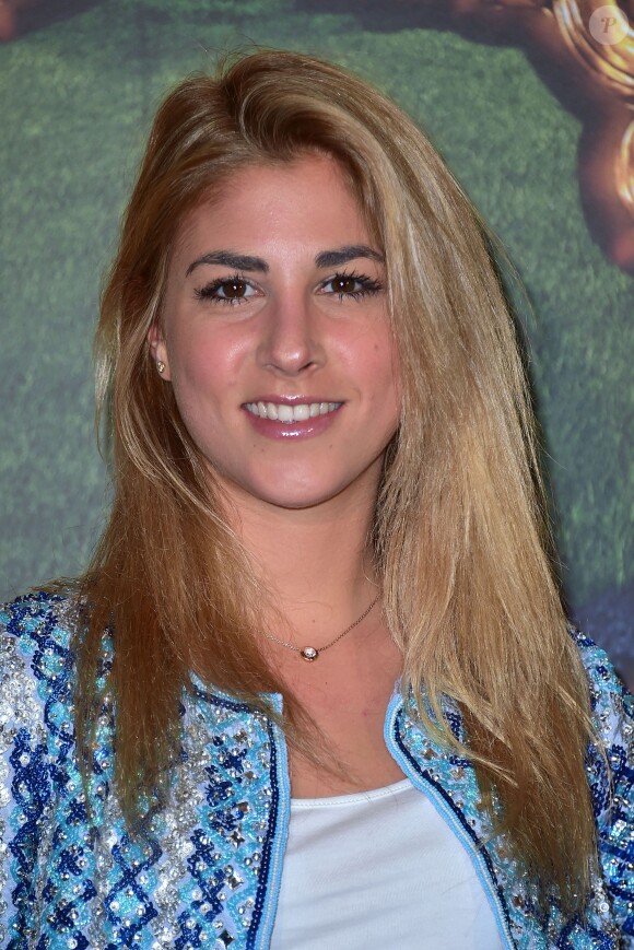 La chanteuse Joyy assiste à l'avant-première du film Cendrillon au Grand Rex à Paris le 22 mars 2015.