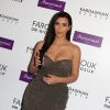 Kim Kardashian marque le lancement des produits capillaires de Kardashian Beauty chez Marionnaud, sur les Champs-Élysées. Paris, le 15 avril 2015.