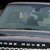Le prince William et la duchesse Catherine de Cambridge dans leur Range Rover le 18 décembre 2013 pour le déjeuner de Noël offert par Elizabeth II.