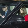 Le prince William et la duchesse Catherine de Cambridge dans leur Range Rover le 18 décembre 2013 pour le déjeuner de Noël offert par Elizabeth II.