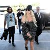Kesha et son petit ami Brad Ashenfelter prennent un vol à l'aéroport de Los Angeles, le 15 avril 2015