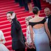 Guillaume Gallienne et Marion Cotillard de dos - Montée des marches du film "The Little Prince" (Le Petit Prince) lors du 68e Festival International du Film de Cannes, le 22 mai 2015.