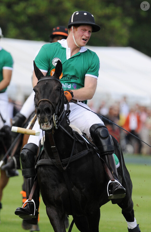 Le prince Harry au club de polo de Cirencester Park dans le Gloucestershire le 24 mai 2015 pour le Jerudong Trophy.