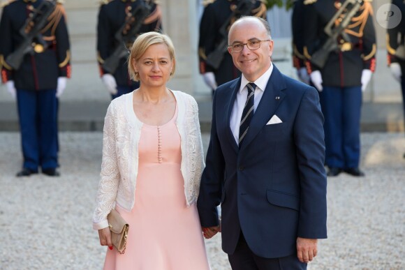 Bernard Cazeneuve et sa femme arrivant à l'Elysée le 2 juin 2015 pour le dîner officiel organisé en l'honneur de la visite d'Etat du roi Felipe VI et de la reine Letizia d'Espagne.