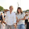 Raymond Domenech et sa compagne Estelle Denis - 3ème trophée de la Pétanque Gastronomique au profit de l'Etoile de Martin (association qui soutient la recherche sur les cancers pédiatriques) à Paris le 2 juillet 2015.