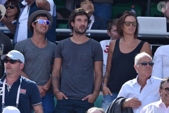Laure Manaudou et son compagnon Jérémy Frérot dans les tribunes de Roland-Garros à Paris, le 7 juin 2015