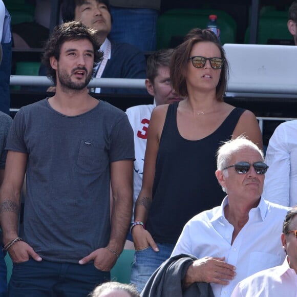 Laure Manaudou et son compagnon Jérémy Frérot dans les tribunes de Roland-Garros à Paris, le 7 juin 2015