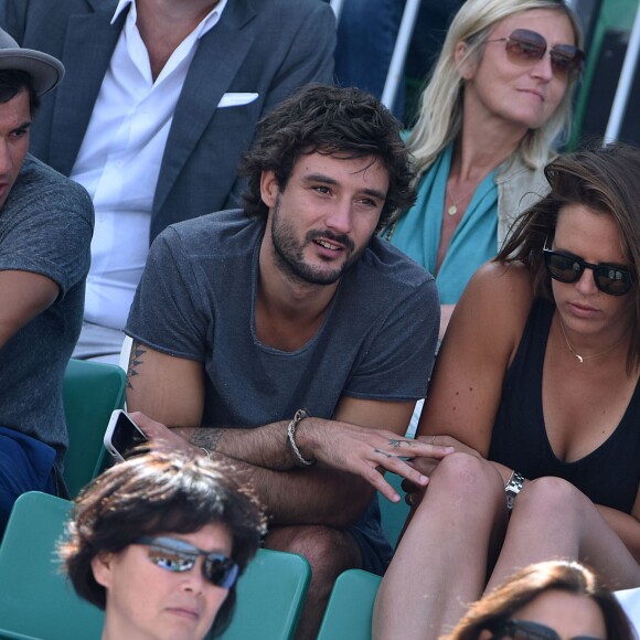 Laure Manaudou et son compagnon Jérémy Frérot dans les tribunes de Roland-Garros à Paris, le 7 juin 2015