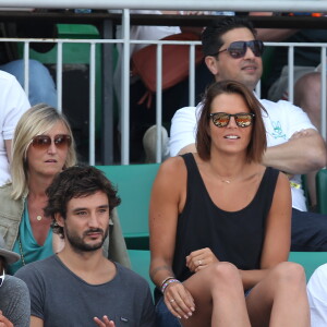 Laure Manaudou et son compagnon Jérémy Frérot dans les tribunes de Roland-Garros à Paris, le 7 juin 2015