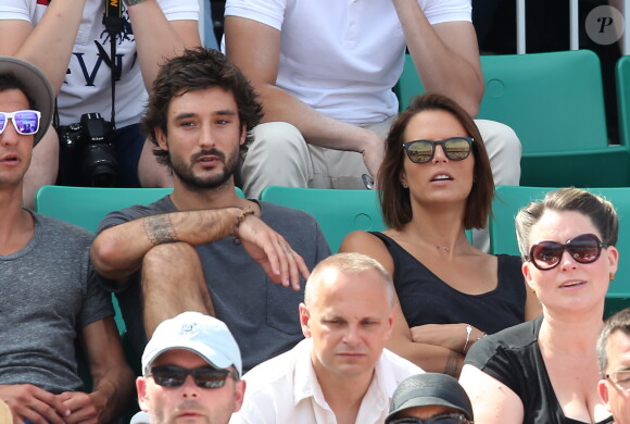Laure Manaudou et son compagnon Jérémy Frérot dans les tribunes de Roland-Garros à Paris, le 7 juin 2015