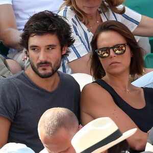 Laure Manaudou et son compagnon Jérémy Frérot dans les tribunes de Roland-Garros à Paris, le 7 juin 2015
