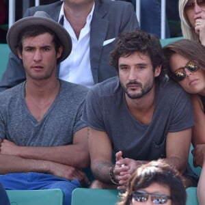 Laure Manaudou et son compagnon Jérémy Frérot dans les tribunes de Roland-Garros à Paris, le 7 juin 2015