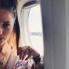Capucine Anav, dans l'avion du départ pour les vacances d'été, sur Instagram, le samedi 1er août 2015.