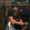 Kim Kardashian, enceinte, et sa fille North West (2 ans) aux studios de la Made Fashion Week à New York, le 7 septembre 2015.
