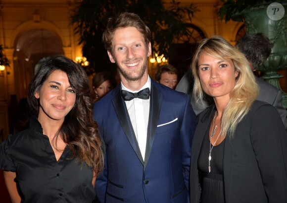 Reem Kherici, Romain Grosjean et Nikita Lespinasse lors du gala de charité au profit de l'association "Enfance et Cancer" à l'hôtel InterContinental de Paris, le 9 septembre 2015