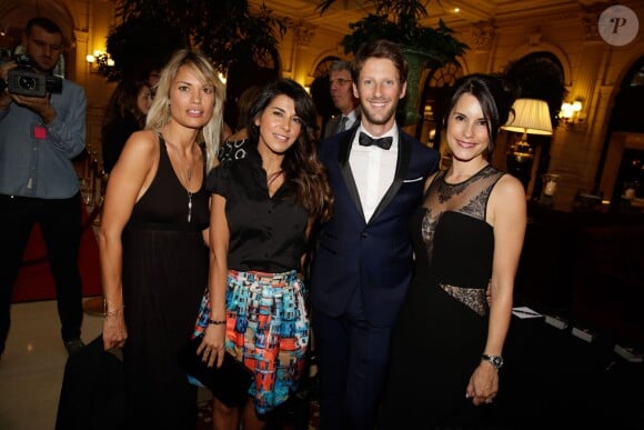 Nikita Lespinasse, Reem Kherici, Romain Grosjean et Marion Jollès lors du gala de charité au profit de l'association "Enfance et Cancer" à l'hôtel InterContinental de Paris, le 9 septembre 2015