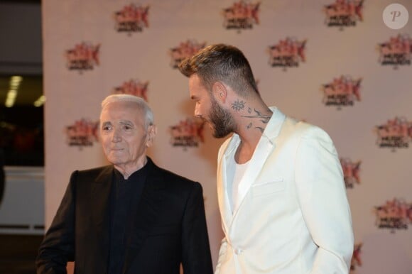Charles Aznavour et M. Pokora, à leur arrivée à la 17e cérémonie des NRJ Music Awards 2015 au Palais des Festivals à Cannes, le 7 novembre 2015.
