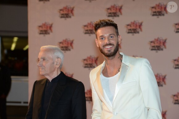Charles Aznavour et M. Pokora, à leur arrivée à la 17e cérémonie des NRJ Music Awards 2015 au Palais des Festivals à Cannes, le 7 novembre 2015.