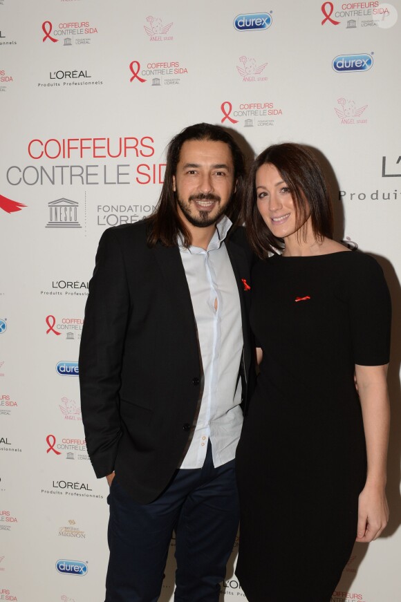 Archives - Moundir et sa femme Inès lors de l'opération " Coiffeurs Contre le Sida " édition 2014 à l'Académie L'Oréal Produits Professionnels à Paris, le 1er décembre 2014.