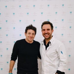 Christophe Michalak et Patrick Bruel - Goûter organisé par le chef pâtissier Christophe Michalak et le Plaza Athénée en faveur de l'Etoile de Martin, le 21 novembre 2015.