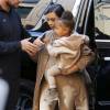Kim Kardashian et sa fille North West, toute de beige vêtue pour le défilé YEEZY (collection Season 2) à New York. Le 16 septembre 2015.
