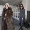 Joan Rivers et sa fille Melissa Rivers arrivent a l'aeroport de Los Angeles. L'actrice de 80 ans porte un long manteau de vison. Le 22 fevrier 2013