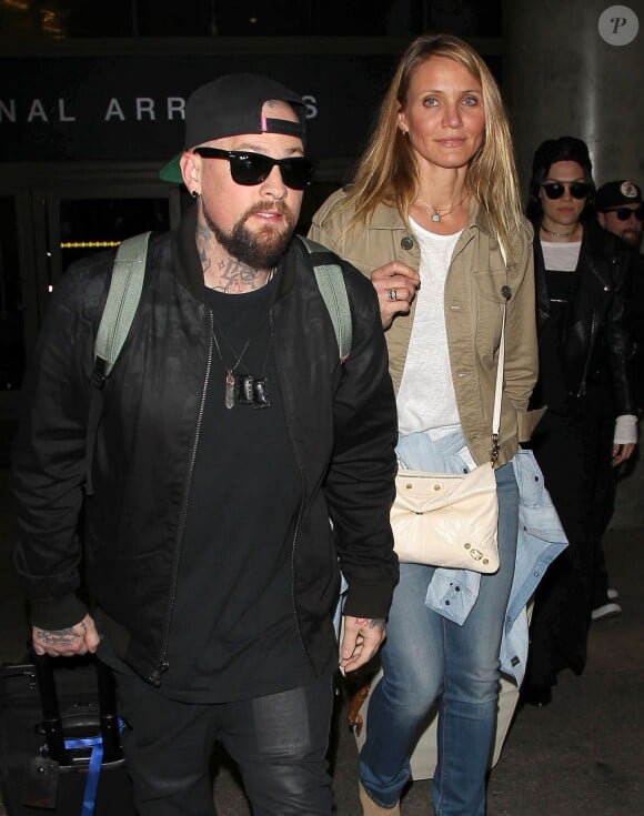 Cameron Diaz et son mari Benji Madden arrivent à l'aéroport de Los Angeles de retour d'Australie, le 31 août 2015.