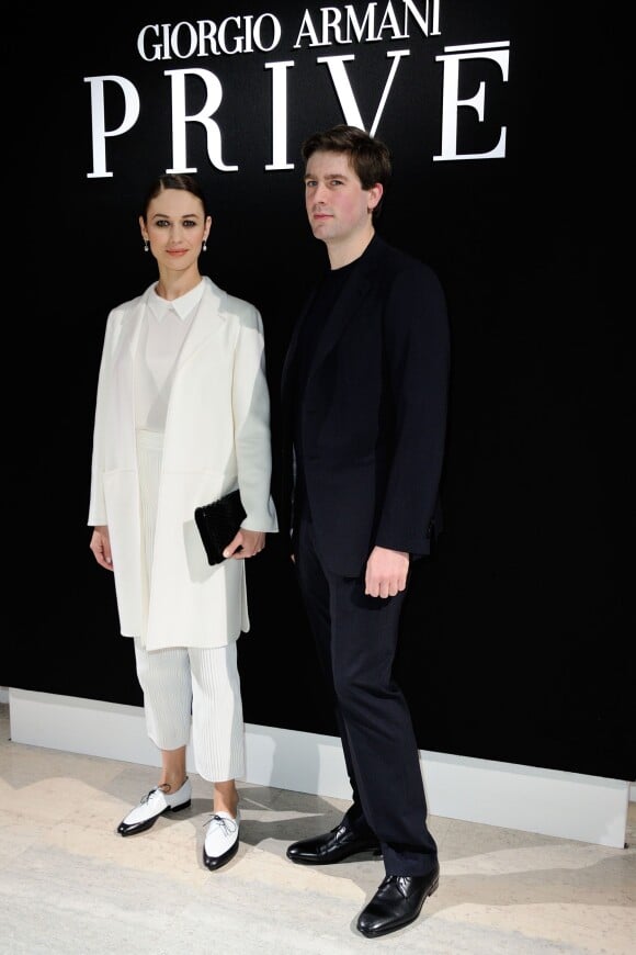 Olga Kurylenko et Max Benitz assistent au défilé Giorgio Armani Privé (collection haute couture printemps-été 2016) au Palais de Tokyo. Paris, le 26 janvier 2016.