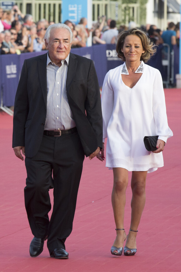 Dominique Strauss-Kahn et sa compagne Myriam L'Aouffir - Avant-première du film "Sin City" lors du 40ème festival du cinéma américain de Deauville, le 13 septembre 2014.