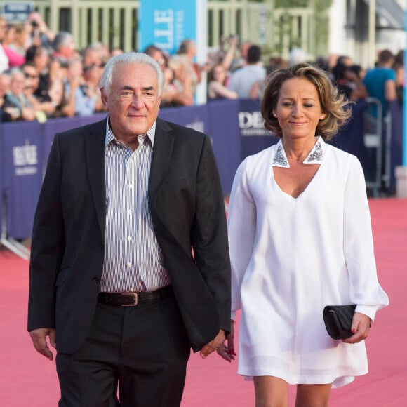 Dominique Strauss-Kahn et sa compagne Myriam L'Aouffir - Avant-première du film "Sin City" lors du 40ème festival du cinéma américain de Deauville, le 13 septembre 2014.