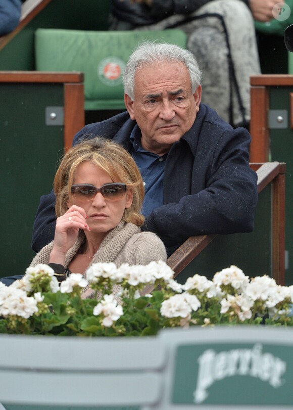 Dominique Strauss-Kahn et sa compagne Myriam L'Aouffir - People assistent au 8 eme sacre de Rafael Nadal lors des Internationaux de France a Roland Garros a Paris le 9 juin 2013.