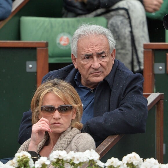 Dominique Strauss-Kahn et sa compagne Myriam L'Aouffir - People assistent au 8 eme sacre de Rafael Nadal lors des Internationaux de France a Roland Garros a Paris le 9 juin 2013.