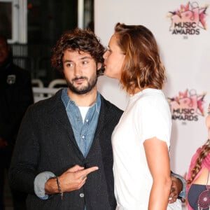 Laure Manaudou et son compagnon Jérémy Frérot aux NRJ Music Awards 2015 au Palais des Festivals à Cannes, le 7 novembre 2015 © Christophe Aubert