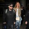 Cameron Diaz et son mari Benji Madden arrivent à l'aéroport de Los Angeles de retour d'Australie, le 31 août 2015.