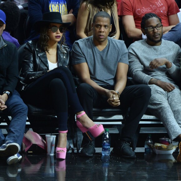 Beyoncé, Jay-Z, et Kendrick Lamar au Staples Center de Los Angeles lors de la rencontre entre les Clippers de Los Angeles et les Warriors de Golden State, le 20 février 2016