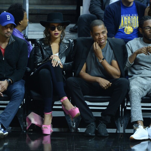 Beyoncé, Jay-Z, et Kendrick Lamar au Staples Center de Los Angeles lors de la rencontre entre les Clippers de Los Angeles et les Warriors de Golden State, le 20 février 2016